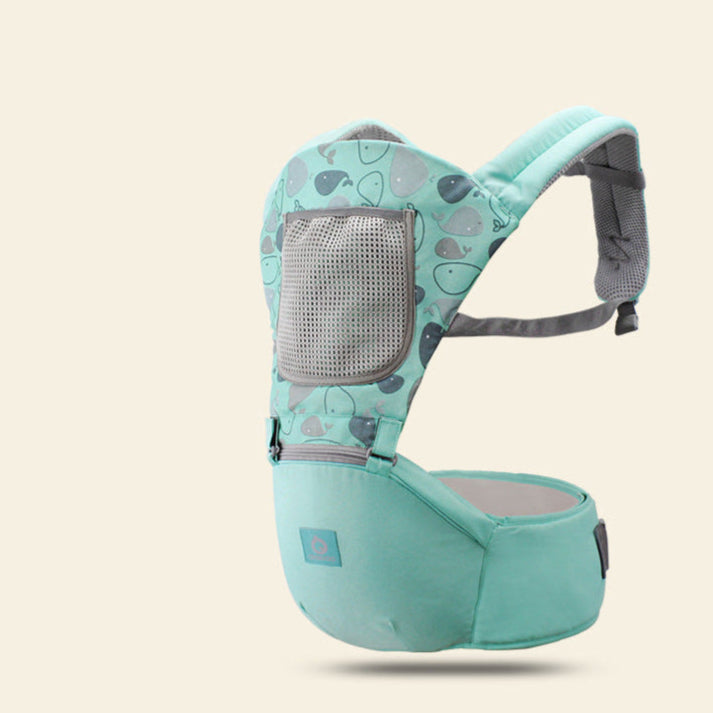 Mint green baby carrier with gray accents on a beige background