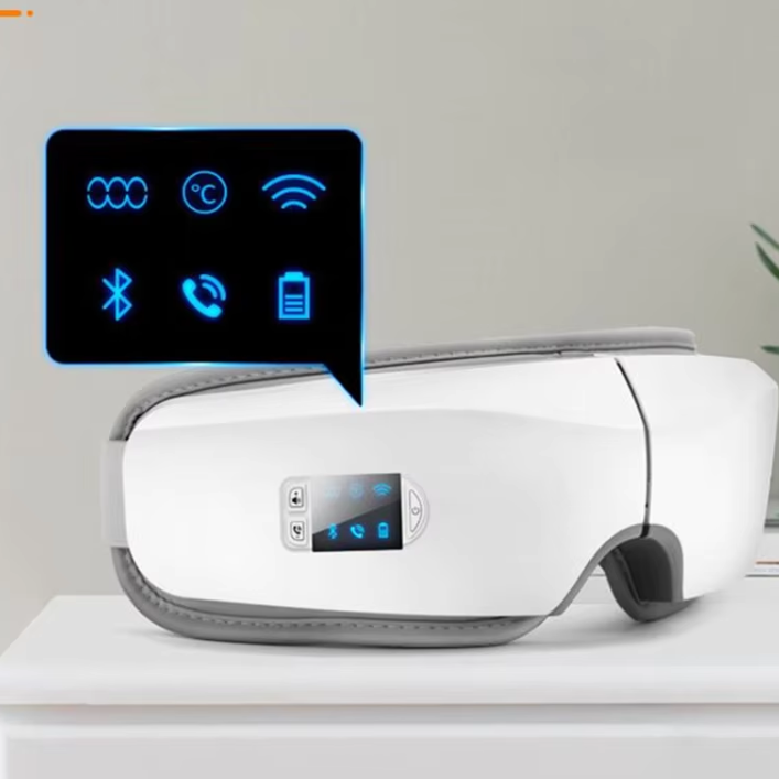 White electronic eye massager  device with digital display on a light gray background