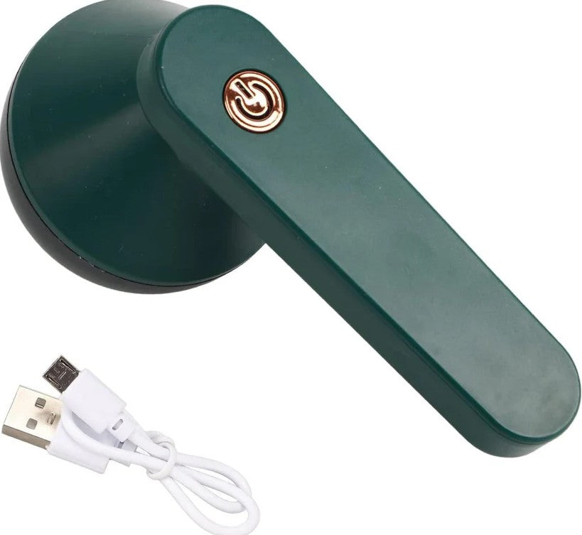 Green handheld electric lint remover device with USB cable on a white background