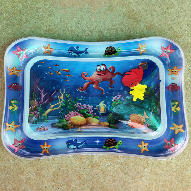 Inflatable water play mat with ocean-themed design on a beige background