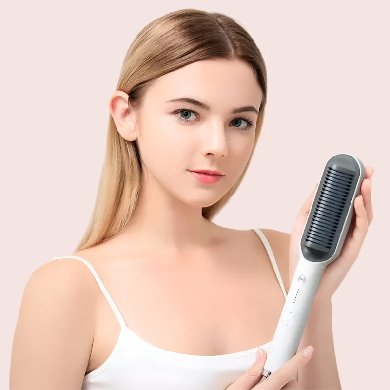 Woman holding a hair straightening brush against a pink background