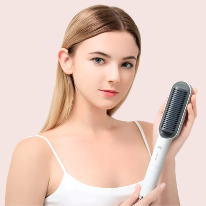 Woman holding a hair straightening brush against a pink background