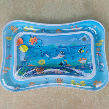 Inflatable water baby mat with underwater animal design on a beige surface