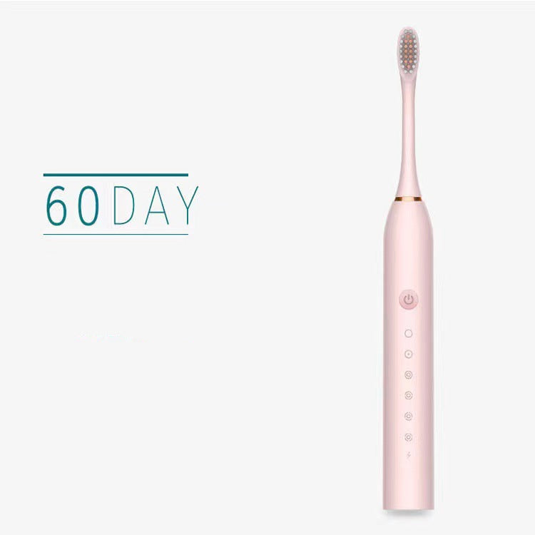 Pink electric toothbrush with text on a white background